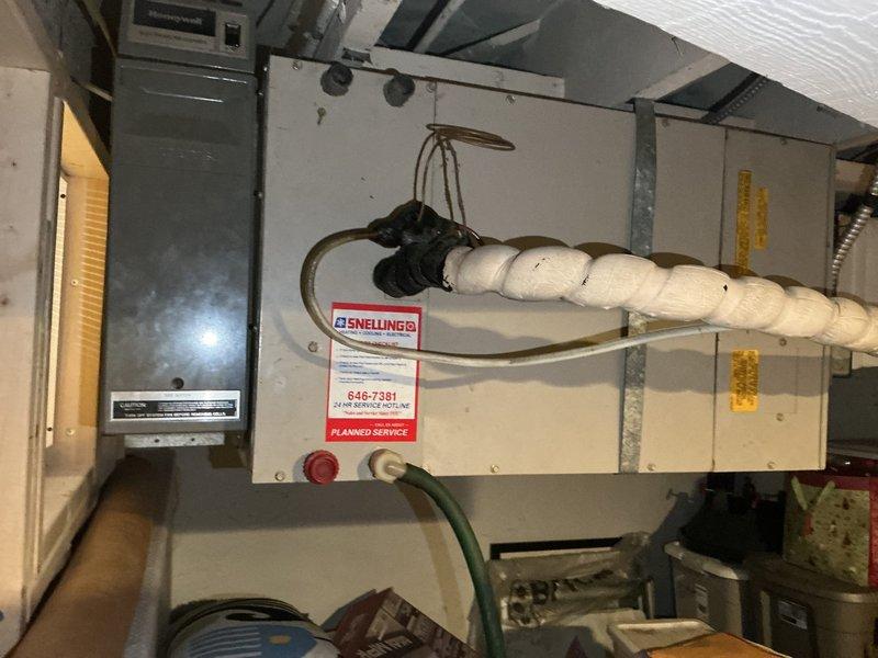 Responded to no cooling complaint on 41-year-old residential air conditioning system. Performed diagnostic evaluation and pressure testing, which revealed system was approximately 3-4 lbs low on R22 refrigerant, indicating a significant leak in the system. Advised customer that adding refrigerant without addressing the underlying leak would result in repeated loss of charge and continued system failure. Provided repair options for R22 leak repair versus full system replacement given the age of equipment and obsolete refrigerant type. Scheduled replacement estimate appointment and documented system condition with photographs of indoor air handler and outdoor condensing unit.