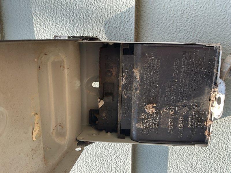 Responded to no cooling complaint on 2007 Goodman AC system. Upon arrival, found indoor temperature at 94°F with outdoor ambient at 107°F in direct sun. Diagnosed dual run capacitor with failed fan side terminal causing compressor to operate while condenser fan remained inoperative. Replaced defective dual run capacitor and tested system operation. Verified proper compressor and condenser fan motor function, confirmed adequate refrigerant charge levels, and left unit operating normally. Advised occupant that extended runtime would be required to bring indoor temperature down to setpoint due to extreme heat load differential.
