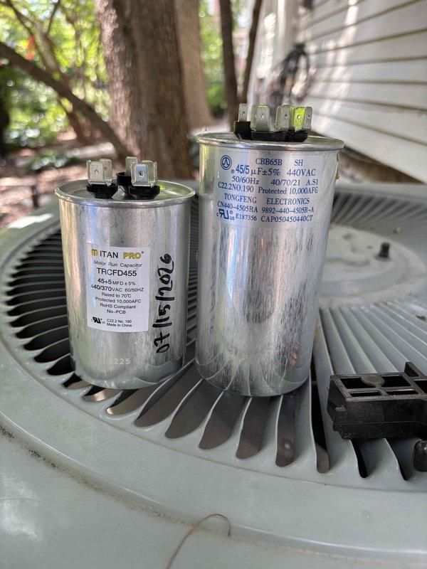 Completed annual cooling maintenance on one standard R-410A air conditioning system and one mini-split system with four heads under ambient conditions of 94°F. Performed comprehensive inspection of standard AC unit including filter, thermostat, temperature split, condenser coils, motors, capacitors, compressor, refrigerant charge levels, and condensate drain. Replaced 16x25x1 air filter and identified failing dual-run capacitor (45+5 MFD) testing below specifications. Upon approval, replaced defective capacitor with new unit, restoring system to proper operation. Conducted maintenance on mini-split system including inspection of filters, thermostat operation, temperature drop across evaporators, condenser unit, and drain lines across all four indoor heads. Both cooling systems tested and confirmed operating within normal parameters upon completion of maintenance procedures.