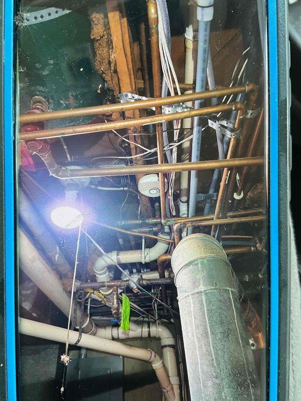 Responded to leaking drain issue caused by clogged condensate line resulting in water backup into furnace heat exchanger. Cleared drain line obstruction and installed new condensate pump with drain line to prevent future drainage failures. Upon inspection, evaporator coil pitch was found to be adequate; blockage was the primary cause of system flooding and furnace cabinet water damage.
