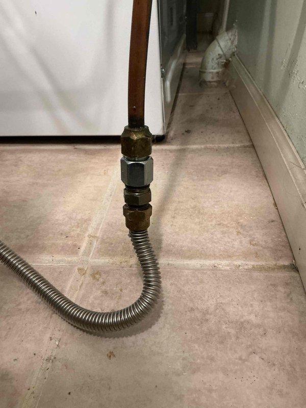 Responded to gas leak emergency at dryer location that had been yellow-tagged by utility company. Upon inspection, identified two loose fittings on the gas line supply piping adjacent to the dryer unit. Disassembled the compromised fittings, applied fresh pipe sealant, and properly reassembled and torqued connections to manufacturer specifications. Performed comprehensive leak detection testing using soap solution on all gas line connections and joints to verify system integrity. Confirmed no further leaks present and restored safe operation of gas supply line to appliance.