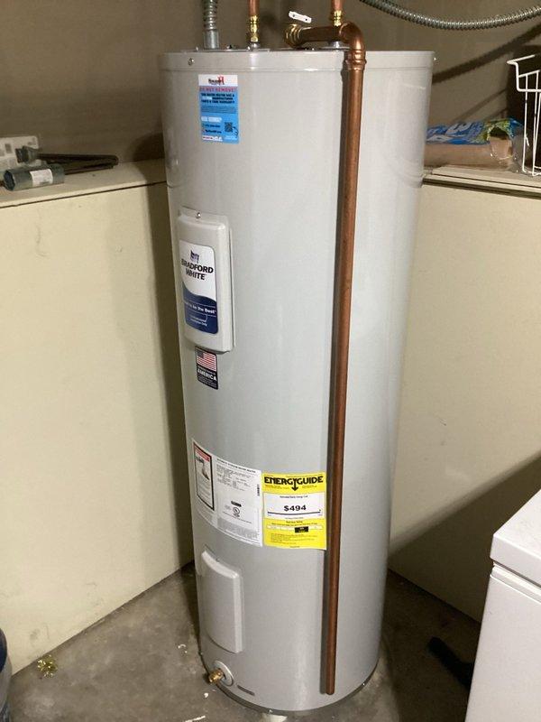 Responded to callback for no hot water following previous day's water heater installation. Upon arrival, discovered disconnect box had been flipped upside down, causing loss of power to unit. Reconnected wiring to disconnect box and restored power to water heater. During testing, experienced intermittent power loss when replacing cover; cycled breaker to restore function. Advised customer that 30-amp breaker may be failing and disconnect box wiring connection is loose and could work free, recommending future electrical repairs to ensure reliable operation.