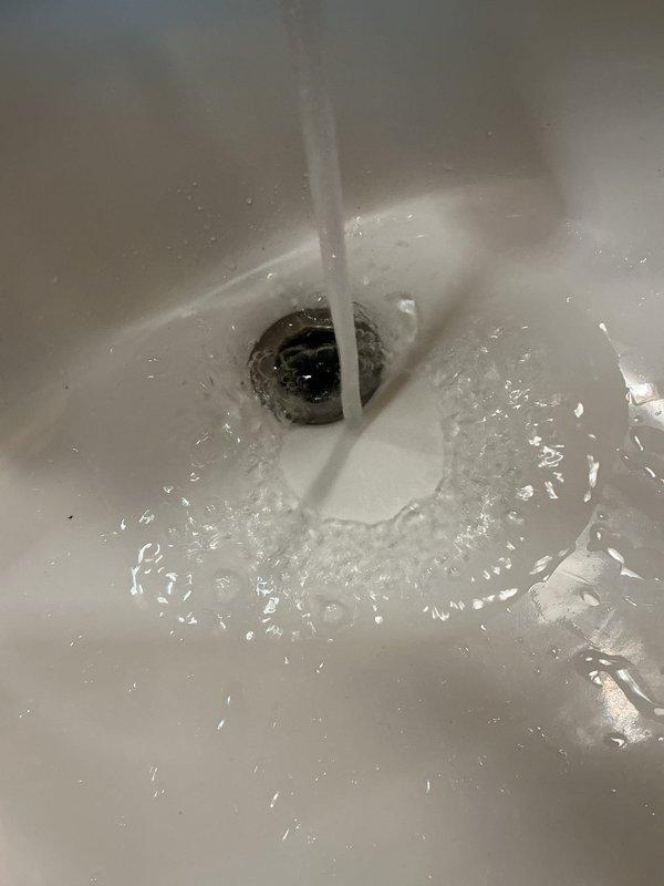 Responded to service call for lavatory sink drain backup and shower head low pressure issues. Upon diagnostic inspection, verified the shower head was restricting flow due to internal debris buildup. Attempted to clear debris but pressure remained inadequate, determining shower head replacement will be necessary. Investigated lavatory sink drain and confirmed blockage, likely caused by hair accumulation. Additionally identified a dripping cold side faucet caused by worn cartridge and a continuously running toilet due to faulty fill valve requiring replacement.

Performed drain cabling on lavatory sink, successfully extracting hair ball obstruction from the line. Tested drain flow and verified proper operation restored. Removed and replaced toilet fill valve assembly, testing to confirm toilet now functions correctly without continuous running. Removed and replaced cold side faucet cartridge, verifying elimination of drip and proper operational function. All completed repairs tested and