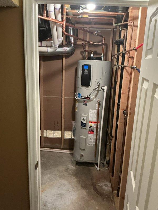 Responded to callback for recurring loud clicking fan noise on Bradford White G2 50-gallon electric hybrid water heater. Unit was producing hot water but fan exhibited same failure symptoms as previous April 2026 repair. Contacted technical support to diagnose repeated fan component failure. Documented unit condition with photographs showing water heater installation, digital display panel, copper supply piping, PVC drainage lines, and overall mechanical room configuration. Ordered replacement fan assembly through manufacturer warranty to resolve ongoing noise issue.