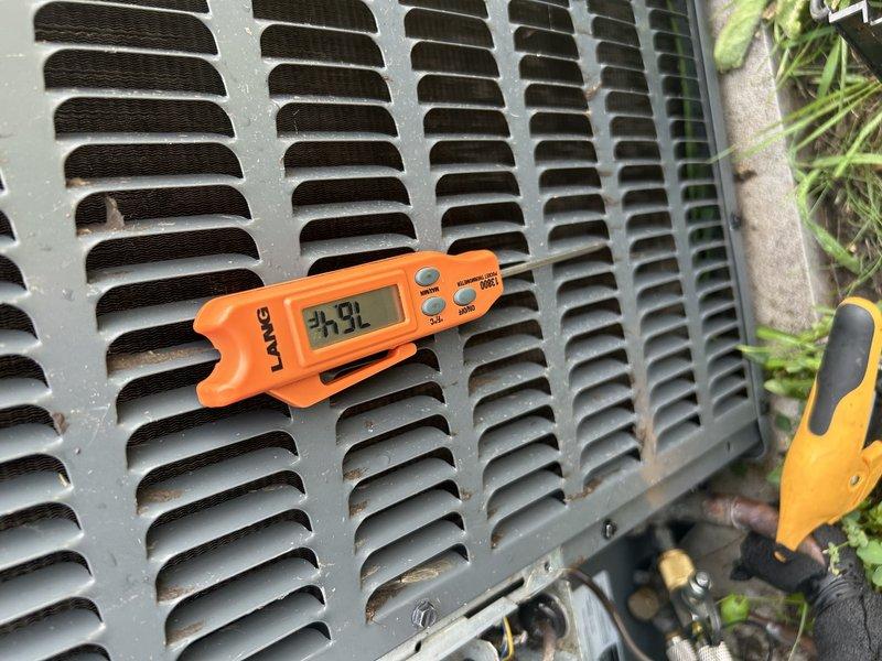 Responded to no cooling complaint on 5-year-old HVAC system that was slow to cool and running continuously. Performed comprehensive tune-up and diagnostic evaluation, which revealed critically low refrigerant charge and weak blower motor capacitor in furnace. Added 2+ pounds of refrigerant to restore proper system charge and bring unit back to operational status. Replaced air filter and verified condensate drain line was clear and flowing properly. Identified damaged plastic housing on outdoor disconnect switch near lug connection, creating potential for loose electrical connection and safety hazard. Recommended replacing blower capacitor in furnace to prevent motor failure and replacing outdoor disconnect switch to ensure safe electrical operation. System cooling performance restored and operating within normal parameters following refrigerant charge correction.