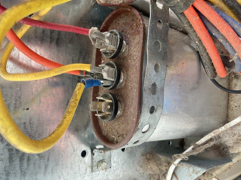 Responded to no-cool complaint with reported intermittent condenser operation and short-cycling every 5 seconds. Upon arrival, system was operational following homeowner's 6-hour breaker reset. Performed diagnostic evaluation on 2016 Nordyne R-410A 3-ton condenser and matching furnace serving large 2-zone residence with cooling zones on 1st and 2nd floors.

Tested outdoor fan capacitor rated at 7.5 µF, measured 5.5 µF—below acceptable tolerance range. Weak capacitor identified as primary cause of intermittent fan starting issues and nuisance shutdowns. Inspected contactor and found visible pitting on contact surfaces, creating secondary intermittent electrical failure point contributing to cycling behavior. Verified all wiring connections intact with no evidence of shorts or damaged conductors. Tested compressor windings, all readings within manufacturer specifications.

Evaluated indoor equipment consisting of 105,000 BTU furnace installed with floor-mounted configuration utilizing si