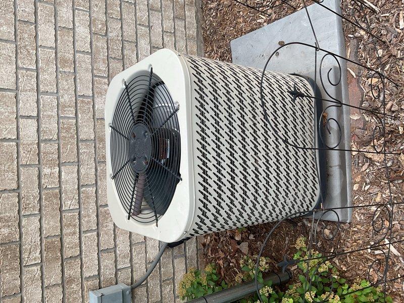 Responded to no-cool complaint with reported intermittent condenser operation and short-cycling every 5 seconds. Upon arrival, system was operational following homeowner's 6-hour breaker reset. Performed diagnostic evaluation on 2016 Nordyne R-410A 3-ton condenser and matching furnace serving large 2-zone residence with cooling zones on 1st and 2nd floors.

Tested outdoor fan capacitor rated at 7.5 µF, measured 5.5 µF—below acceptable tolerance range. Weak capacitor identified as primary cause of intermittent fan starting issues and nuisance shutdowns. Inspected contactor and found visible pitting on contact surfaces, creating secondary intermittent electrical failure point contributing to cycling behavior. Verified all wiring connections intact with no evidence of shorts or damaged conductors. Tested compressor windings, all readings within manufacturer specifications.

Evaluated indoor equipment consisting of 105,000 BTU furnace installed with floor-mounted configuration utilizing si