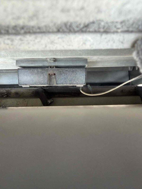 Responded to no cooling complaint on commercial rooftop unit. Upon arrival, determined system was operational with no mechanical failures. Investigation revealed wildfire smoke infiltration through economizer damper during operation. Confirmed no jumper pin was installed in economizer control, allowing outdoor air intake during smoke conditions. Advised customer to power unit off during evening hours and restart in morning to minimize smoke entry until air quality improves.