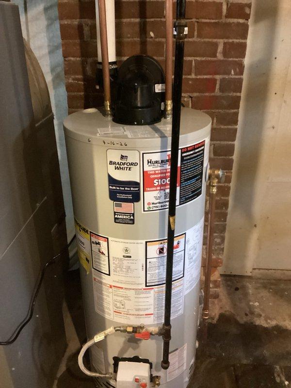 Replaced malfunctioning 40-gallon natural gas power vent water heater that was stuck in vacation mode with new Bradford White unit. Installed new water heater in existing location with proper copper piping connections, brass fittings, shutoff valves, and flexible connector lines, ensuring all connections met code requirements and manufacturer specifications.