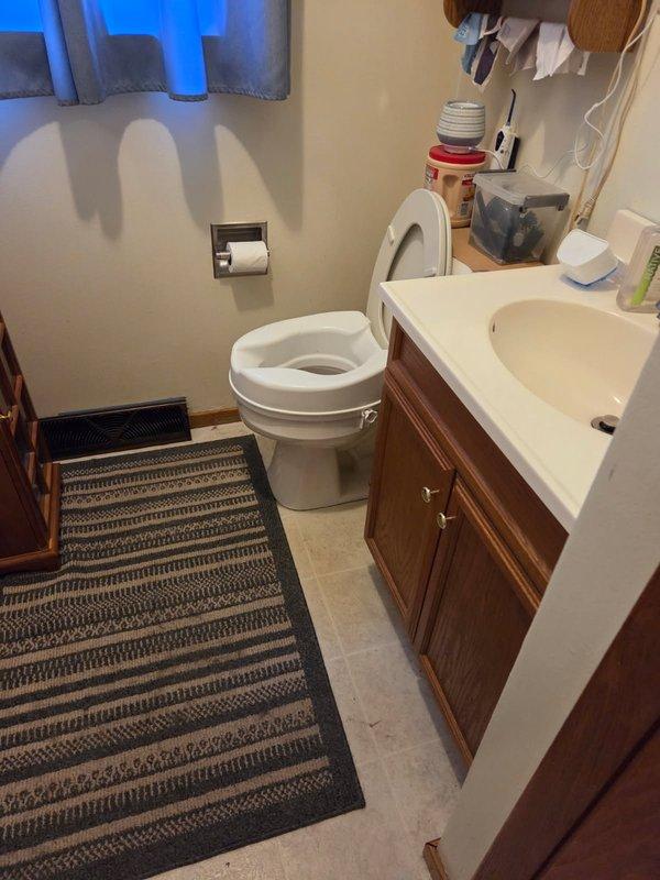 Conducted on-site evaluation for installation of ADA-compliant high-rise toilet in residential bathroom. Assessed existing plumbing configuration, floor space, and rough-in measurements to determine compatibility with comfort-height fixture. Documented current standard toilet installation and bathroom layout through photographs. Provided customer with estimate for toilet replacement and discussed pressure-assisted tank options to improve flushing performance.