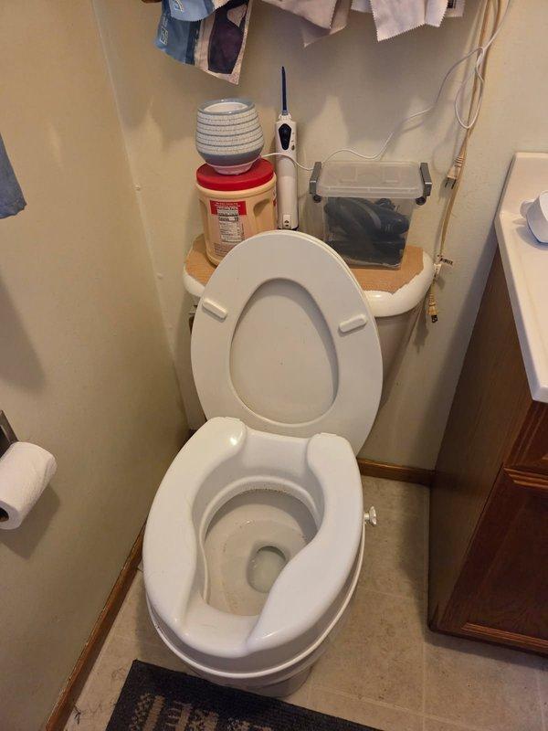 Conducted on-site evaluation for installation of ADA-compliant high-rise toilet in residential bathroom. Assessed existing plumbing configuration, floor space, and rough-in measurements to determine compatibility with comfort-height fixture. Documented current standard toilet installation and bathroom layout through photographs. Provided customer with estimate for toilet replacement and discussed pressure-assisted tank options to improve flushing performance.