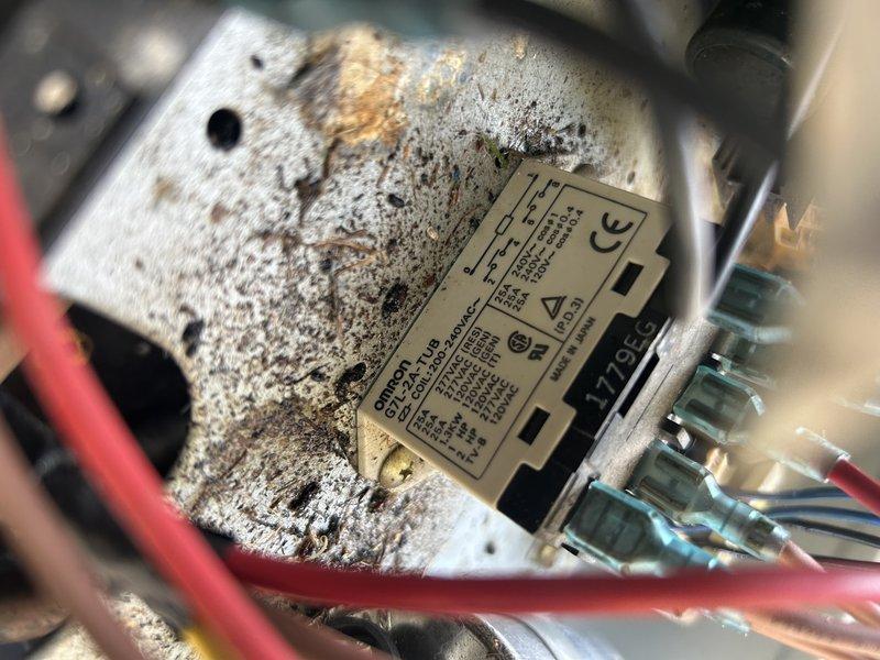 Responded to return service call for intermittent no cool condition on split air conditioning system. Upon arrival, confirmed unit was cycling on and off erratically with compressor and outdoor fan motor shutting down unexpectedly. Performed diagnostic testing and traced fault to defective contactor relay controlling power supply to compressor and condenser fan motor. Verified failure by manually tapping relay, which caused unit to shut off and restart, confirming internal contact degradation. Observed significant debris accumulation and evidence of previous rodent intrusion in outdoor unit. Provided customer with pricing for contactor relay replacement to restore reliable system operation.