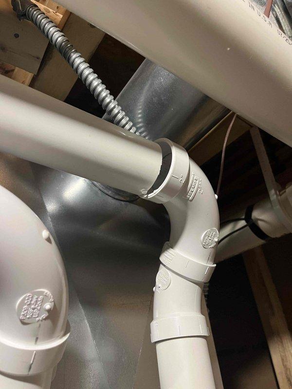 Responded to report of water dripping from furnace intake vent. Upon inspection, identified condensation forming inside the intake pipe due to temperature differential between warmer outdoor air and cooler indoor conditions. Documented findings with photos showing PVC intake piping configuration and surrounding HVAC components. Generated order form for drain kit installation to resolve condensation issue and prevent future water intrusion into the intake system.