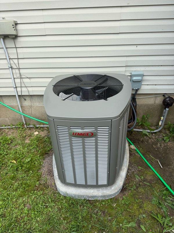 Replaced undersized residential air conditioning unit with upgraded 2.5-ton Lennox EL15KC1-030 system to address inadequate cooling capacity. Existing coil was evaluated and determined to be compatible with new unit, allowing for retention and cost savings. Removed original equipment, installed new condenser on existing concrete pad, connected refrigerant lines to existing coil, completed electrical connections, and tested system for proper operation and cooling performance.