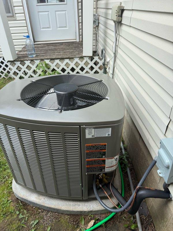 Replaced undersized residential air conditioning unit with upgraded 2.5-ton Lennox EL15KC1-030 system to address inadequate cooling capacity. Existing coil was evaluated and determined to be compatible with new unit, allowing for retention and cost savings. Removed original equipment, installed new condenser on existing concrete pad, connected refrigerant lines to existing coil, completed electrical connections, and tested system for proper operation and cooling performance.