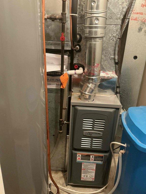 Responded to no cooling complaint on 30-year-old residential air conditioning system. Upon diagnosis, found system critically low on obsolete R22 refrigerant, causing evaporator coil to freeze and resulting in water leakage onto furnace below. Outdoor condenser coils showed significant dirt accumulation from lack of maintenance history. Connected manifold gauges to verify low refrigerant charge and confirmed frozen indoor coil condition. Due to age of system, obsolete refrigerant type, and cost-prohibitive nature of R22 recharge, recommended complete system replacement rather than temporary repair. Scheduled follow-up estimate appointment for new air conditioning system installation.