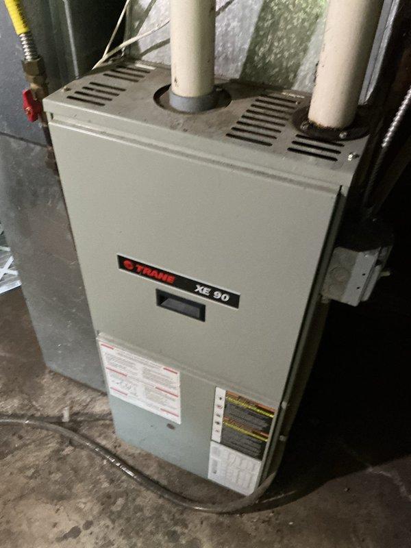 Responded to no cooling complaint on 10-year-old residential central air conditioning system. Upon inspection, found condenser coil completely plugged with dust and debris, causing reduced airflow and system inefficiency. Performed thorough condenser coil cleaning to restore proper heat transfer and airflow. System tested and operating within normal parameters following service. Comfort advisor consulted regarding system age and performance.
