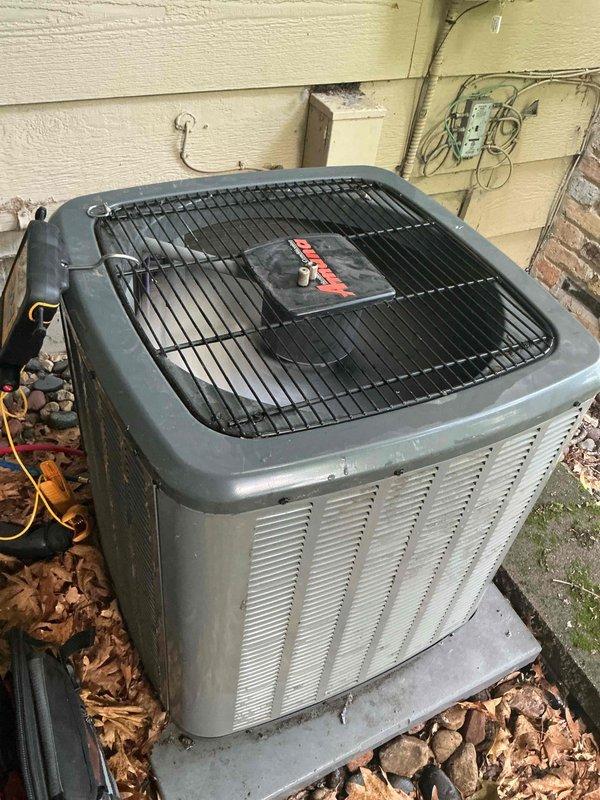 Performed comprehensive air conditioning tune-up on 2-3 year old residential outdoor condensing unit. During inspection, identified weak capacitor affecting system performance. Replaced defective capacitor with new component to restore proper operation and enrolled customer in family rewards program for future maintenance benefits.