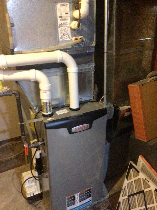 Responded to callback for AC system not adequately cooling during afternoon heat. Performed refrigerant charge check with readings of 295 PSI liquid line at 82°F and 115 PSI suction at 60°F. Identified airflow issues including an open return vent behind temporary wall pulling cold basement air into system. Closed problematic return vent, verified all supply vents were open and return vents unobstructed. Reduced blower speed by approximately 170 CFM to optimize system performance and dehumidification. Recommended monitoring system performance over next 24-48 hours to evaluate effectiveness of airflow corrections.