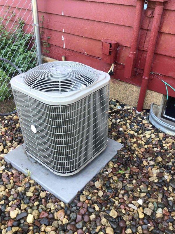 Completed comprehensive AC tune-up on 11-year-old residential cooling system. Performed full electrical testing on outdoor condenser unit with all readings within manufacturer specifications, power washed exterior coil and housing, verified air filter condition showing recent replacement, and confirmed proper system operation with 20-degree temperature split across evaporator coil.