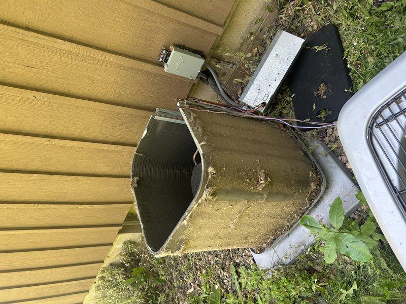Responded to condensate leak at furnace with water accumulation underneath unit. Found severely clogged air filter and piece of insulation blocking condensate pan and drain line. Removed debris, cleared condensate drain system, and performed complete system tuneup on AC unit including cleaning of coils and inspection of all components. System restored to proper operation with cooling functioning as designed. Recommended immediate filter replacement to prevent future issues.