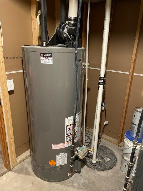 Responded to no hot water complaint and found gas water heater in safety lockout due to maximum ignition attempts being reached. Reset the system, disassembled and cleaned the burner assembly to remove debris and buildup affecting ignition performance. Reassembled unit, verified proper gas ignition sequence, confirmed stable flame operation, and tested system to ensure proper heat production and hot water delivery restored.