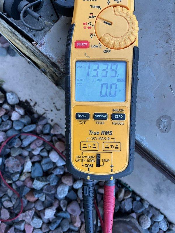 Responded to no cooling call on 41-year-old residential air conditioning system originally installed in 1985. Found tripped breaker at outdoor unit and measured excessive amperage draw on compressor circuit using digital multimeter. Reset breaker temporarily to verify system operation, but compressor continued to draw high amps indicating internal failure. Comfort advisor appointment was already scheduled for same day to discuss system replacement options due to age and failed compressor.