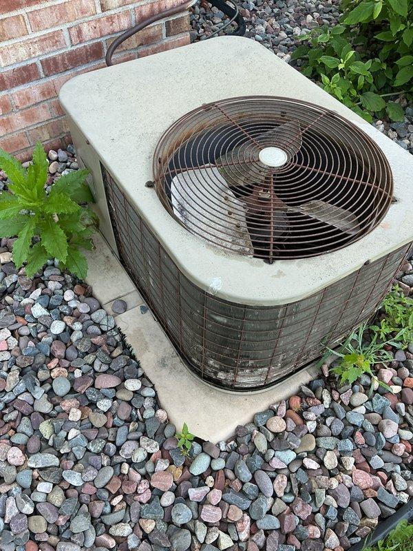 Responded to no cooling call on 41-year-old residential air conditioning system originally installed in 1985. Found tripped breaker at outdoor unit and measured excessive amperage draw on compressor circuit using digital multimeter. Reset breaker temporarily to verify system operation, but compressor continued to draw high amps indicating internal failure. Comfort advisor appointment was already scheduled for same day to discuss system replacement options due to age and failed compressor.