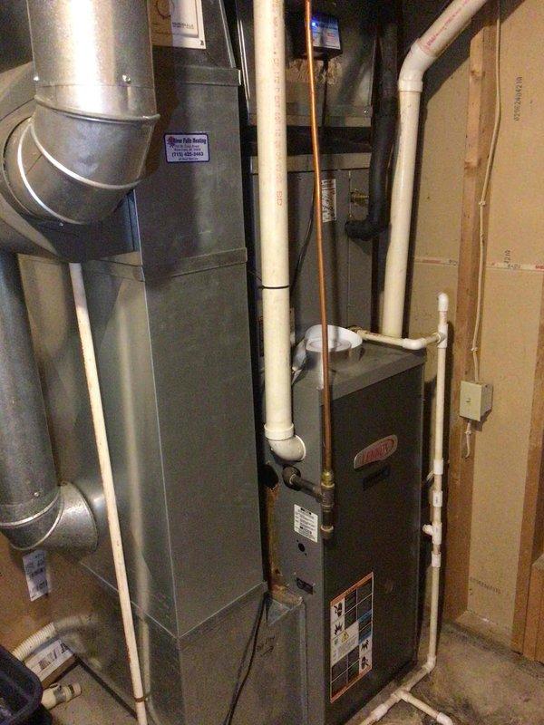 Performed AC tune-up on 2008 R22 system experiencing inadequate cooling performance. Verified refrigerant charge at proper levels, cleaned condenser coil, confirmed filter recently replaced, and checked blower speeds operating correctly. Upon inspection, discovered existing leak at furnace cold header plug with significant internal rust damage. Recommended full system replacement due to age of unit, R22 refrigerant phase-out, and deteriorating furnace condition compromising system reliability.