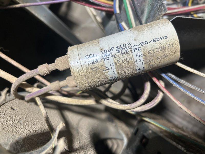 Responded to service call for noisy furnace on 20+ year old unit. Upon inspection, found blower motor and fan assembly heavily coated with dust, debris, and grease buildup due to severely clogged air filter that had not been changed in approximately one year. Replaced dirty air filter with new filter and tested blower motor capacitor, which measured 6.8 MFD out of rated 10 MFD capacity. Blower motor exhibited excessive noise due to accumulated contamination on motor housing and fan wheel. Provided equipment replacement options and pricing for new blower motor and capacitor. Customer approved blower motor replacement to resolve noise issue and restore proper airflow. Supplied additional replacement filter for future maintenance.