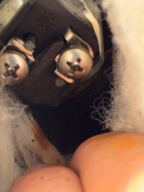 Responded to a callback for water accumulation under the water heater following a recent element and thermostat replacement. Upon inspection, confirmed no leaks at either element port despite visible corrosion around the element openings. Discovered the lower element insulation retained moisture from water intrusion during the previous service, and identified a dripping drain valve. Expelled trapped water from the jacket insulation, cleaned up standing water beneath the unit and around the exterior, and installed a cap on the drain port to stop the drip. Left access covers removed to facilitate air circulation and drying of the insulation over the next several days. Provided a replacement estimate should the moisture issue persist after the drying period.
