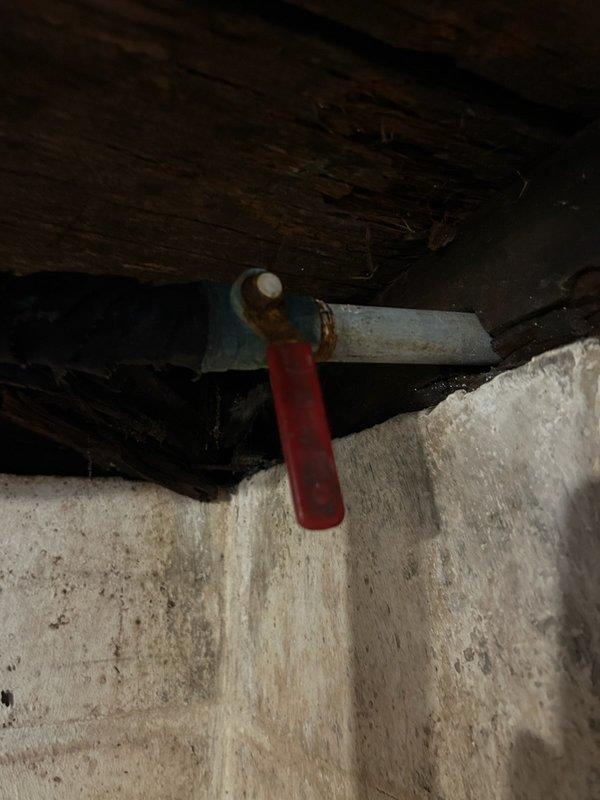 Responded to service call for plumbing issues in basement area. Replaced defective water gate ball valve junction at main shut-off location in cellar. Installed new backflow preventer with anti-siphon device for exterior hose connection, as previous installation lacked required backflow prevention. Both the main shut-off valve and backflow prevention system were non-compliant and required immediate replacement to ensure proper water system protection and code compliance.