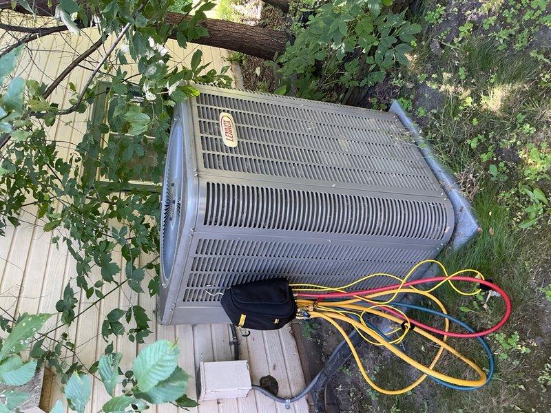 Responded to no cooling complaint on one-year-old residential A/C system. Upon arrival, unit was operating normally after homeowner had replaced air filter and cycled power at breaker. Inspection revealed outdoor condenser coils heavily clogged with cottonwood debris, severely restricting airflow. During recent two-week period of 90-degree temperatures, the combination of dirty air filter and blocked condenser coils caused system to shut down on safety. 

Performed comprehensive system diagnostics including control board inspection, refrigerant charge verification, temperature delta-t measurements, air filter condition check, and blower speed testing. All parameters found within normal operating specifications. Advised homeowner to rinse condenser coils to restore proper airflow. System restored to full cooling operation. Covered under warranty; advised future occurrences due to lack of maintenance will be billable service calls.