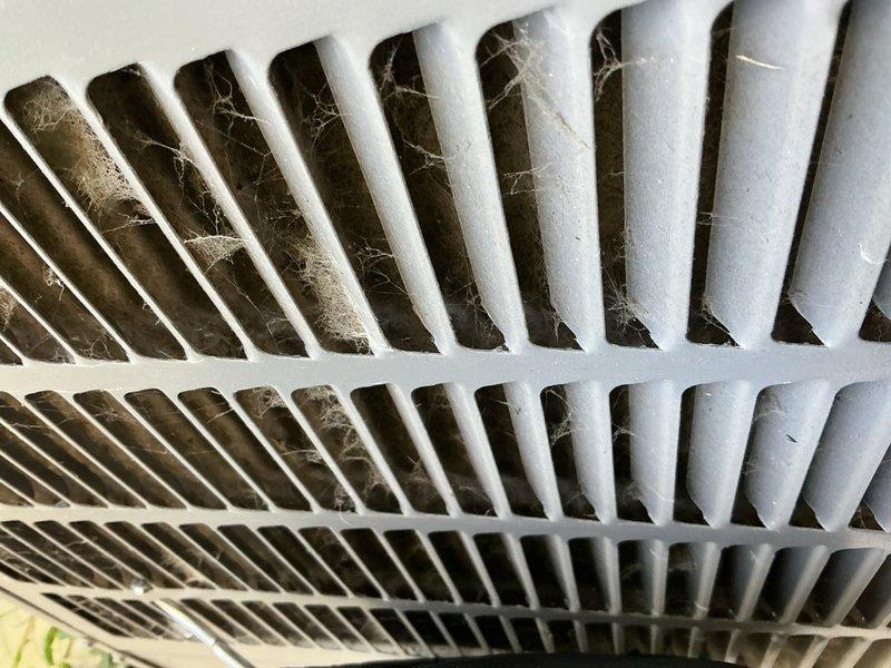 Responded to no cooling complaint on one-year-old residential A/C system. Upon arrival, unit was operating normally after homeowner had replaced air filter and cycled power at breaker. Inspection revealed outdoor condenser coils heavily clogged with cottonwood debris, severely restricting airflow. During recent two-week period of 90-degree temperatures, the combination of dirty air filter and blocked condenser coils caused system to shut down on safety. 

Performed comprehensive system diagnostics including control board inspection, refrigerant charge verification, temperature delta-t measurements, air filter condition check, and blower speed testing. All parameters found within normal operating specifications. Advised homeowner to rinse condenser coils to restore proper airflow. System restored to full cooling operation. Covered under warranty; advised future occurrences due to lack of maintenance will be billable service calls.