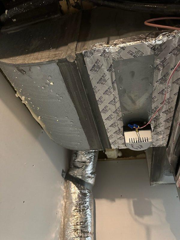 Responded to report of water leak and dripping from ceiling with unknown source. Upon investigation, accessed attic space and inspected plumbing lines, HVAC system, and ductwork. Determined leak was not plumbing-related but caused by HVAC condensation issue related to venting problem in the air handler system. Documented findings with photographs showing ductwork configuration and affected ceiling area. Advised customer that HVAC technician would need to address the condensation drainage issue to resolve the water leak.