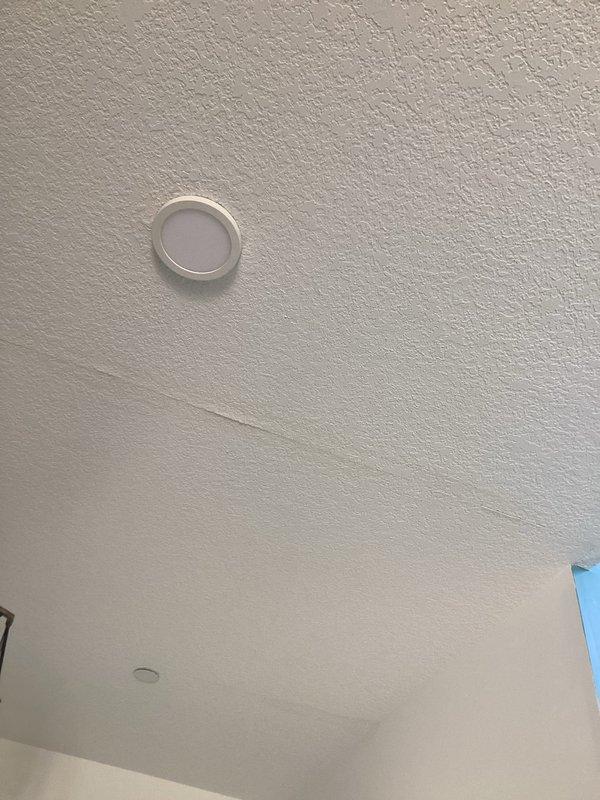 Responded to report of water leak and dripping from ceiling with unknown source. Upon investigation, accessed attic space and inspected plumbing lines, HVAC system, and ductwork. Determined leak was not plumbing-related but caused by HVAC condensation issue related to venting problem in the air handler system. Documented findings with photographs showing ductwork configuration and affected ceiling area. Advised customer that HVAC technician would need to address the condensation drainage issue to resolve the water leak.