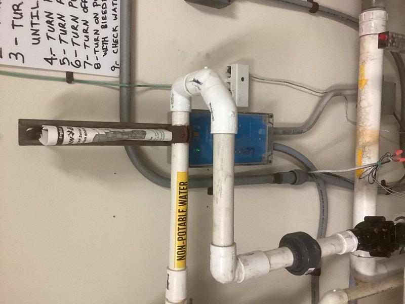 Responded to emergency call for leaking 1-inch PVC pipe in pool room mechanical area. Upon arrival, identified active leak at 90-degree elbow joint on non-potable water inlet line. Shut off water supply, removed failed PVC 90 fitting, and installed new elbow with proper primer and solvent cement. Utilized rubber coupling connectors to ensure secure, watertight seal at pipe joints. Restored water flow and pressure-tested all connections to verify complete leak elimination with no further dripping or seepage detected.