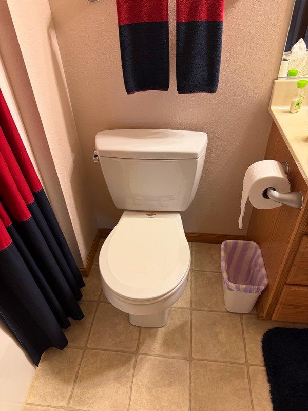 Responded to diagnose toilet flapper issue and inspect egress window drain system. Tested toilet flapper seal by performing multiple flush cycles and monitoring fill valve operation—flapper functioning properly with no leaks detected. Deployed portable inspection camera through egress window drain line to foundation, confirming drain pipe is clear and unobstructed. Identified drainage issue caused by drain cover blocked by rubber matting and rocks, restricting water flow. Discovered black tarp installed beneath rock layer in window well, preventing proper water percolation and drainage. Advised property owner to remove tarp and redistribute rock fill to restore proper drainage function.
