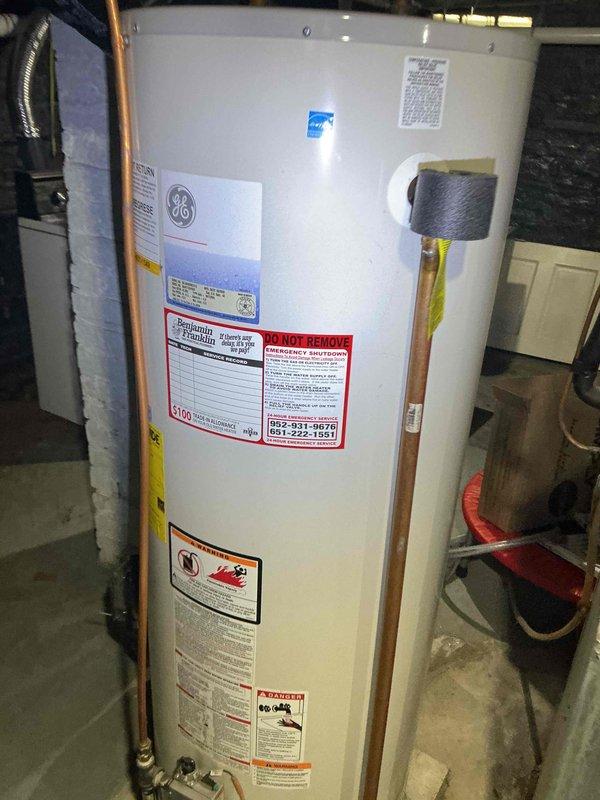 Responded to no cooling complaint on 8-year-old residential A/C system. Upon arrival, found compressor running excessively hot with no refrigerant present in the system. Diagnosed complete loss of refrigerant charge due to system leak. Inspected electrical connections at breaker panel and confirmed power supply to condensing unit. Documented equipment condition and provided estimate for refrigerant leak detection, repair, and system recharge to restore cooling operation.