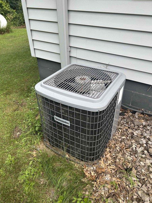 Responded to no cooling call on 30-year-old residential air conditioning system. Upon inspection, discovered extensive rodent nesting material inside electrical panel causing system failure. Vacuumed out all debris from electrical compartment and identified damaged bare wiring created by rodent activity. Repaired all compromised electrical connections and replaced out-of-specification capacitor. After repairs, system operated properly with 17-degree temperature split across evaporator coil, confirming adequate cooling performance.