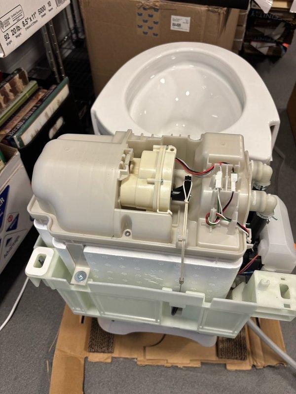 Responded to warranty call for damaged Toto toilet bowl and malfunctioning flush valve assembly. Installed replacement bowl and flush valve assembly with all associated components after repair parts were received. Completed full repair and restoration of toilet to proper working condition.