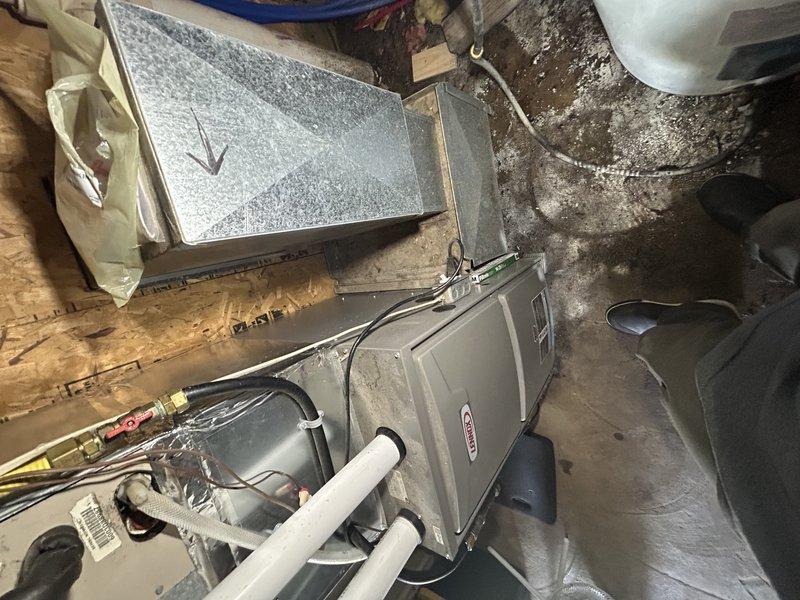 Responded to no cooling complaint on central air conditioning system. Upon inspection, found blown fuses and damaged, mangled disconnect at outdoor unit. Identified damaged wiring as contributing factor to fuse failure. Temporarily bypassed faulty disconnect to continue diagnostics. Circuit breaker continued to trip after bypass, indicating additional electrical fault. Performed amp draw testing and diagnostics on compressor, which revealed compressor failure causing breaker to trip. Documented damaged electrical components with photos showing deteriorated wire insulation and compromised connections. Provided pricing options for compressor replacement. System remains inoperable pending approval from property owner, as occupants are in rent-to-own agreement and require owner authorization before proceeding with repairs.