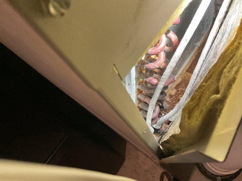 Responded to service call for air conditioning system with insufficient cooling. Upon arrival, performed diagnostic testing and found temperature split of only 2-3 degrees across the evaporator coil. Measured refrigerant charge parameters and identified critically low refrigerant levels with superheat reading of 54 degrees, indicating significant undercharge. Inspected evaporator coil assembly and refrigerant lines for potential leak sources. Provided detailed pricing options for refrigerant recharge and system repair recommendations, with customer requesting additional consultation before proceeding with repairs.