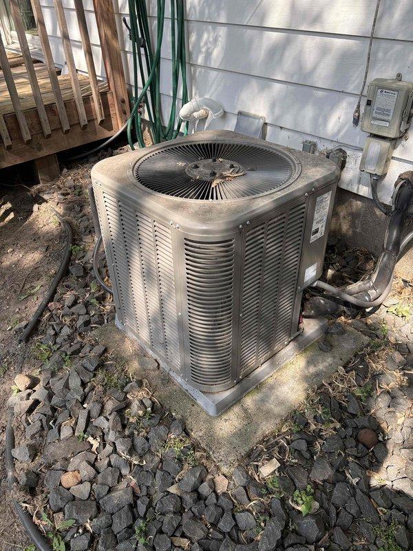 Completed comprehensive AC maintenance on one Lennox condenser unit utilizing R-410A refrigerant in 93-degree ambient conditions. Performed full system inspection including filter, thermostat, temperature split, condenser, coils, motors, capacitors, compressor, refrigerant levels, and condensate drain. Replaced 14x20x1 air filter from van stock. Diagnosed system short cycling caused by heavily soiled outdoor condenser coil restricting airflow. Thoroughly rinsed down outdoor coil to restore proper heat transfer and system operation. Verified all components functioning correctly with proper cycling restored upon completion.