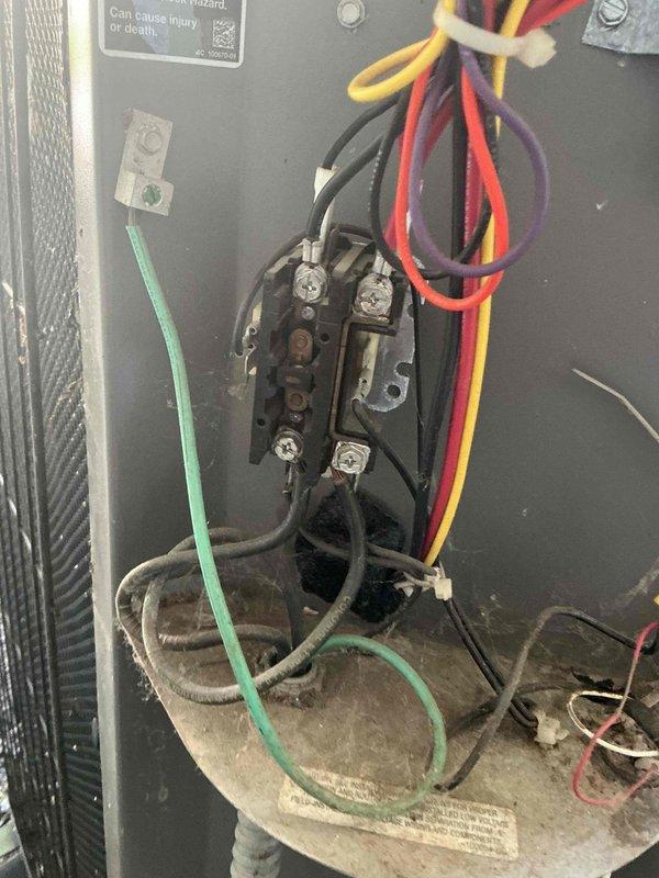 Responded to no cool call on 20-25 year old Lennox AC system with indoor temperature at 75°F and rising with thermostat set to 73°F. Upon arrival, found compressor out on overload protection. Identified unit uses R22 refrigerant by cross-referencing system details through Bluon database due to worn rating plate. Performed static pressure test revealing system low on refrigerant charge and actively losing pressure. Detected refrigerant odor at condensate drain line, indicating probable evaporator coil leak. Verified capacitor and contactor operational through electrical testing. Checked compressor winding resistance to confirm overload switch in open position. Due to company policy discontinuing R22 refrigerant repairs, advised customer that system replacement is only available option. Scheduled service advisor consultation for following day to discuss new equipment installation.