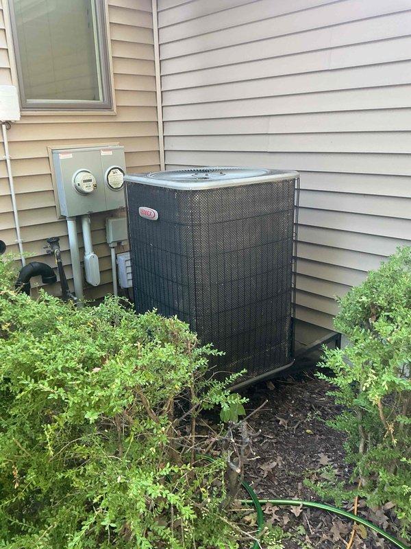 Responded to no cool call on 20-25 year old Lennox AC system with indoor temperature at 75°F and rising with thermostat set to 73°F. Upon arrival, found compressor out on overload protection. Identified unit uses R22 refrigerant by cross-referencing system details through Bluon database due to worn rating plate. Performed static pressure test revealing system low on refrigerant charge and actively losing pressure. Detected refrigerant odor at condensate drain line, indicating probable evaporator coil leak. Verified capacitor and contactor operational through electrical testing. Checked compressor winding resistance to confirm overload switch in open position. Due to company policy discontinuing R22 refrigerant repairs, advised customer that system replacement is only available option. Scheduled service advisor consultation for following day to discuss new equipment installation.