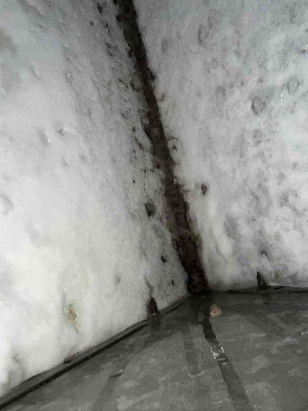 Responded to no cooling complaint and found evaporator coil completely frozen over with heavy ice buildup. Thawed evaporator coil and performed system test on R-22 air conditioning unit. Diagnostics confirmed system is low on refrigerant charge. Explained R-22 refrigerant phase-out, limited availability, and increasing costs associated with repairs on older R-22 systems. Customer opted to pursue full system replacement rather than repair existing unit. Scheduled equipment replacement appointment for Saturday afternoon and provided new equipment pricing options.