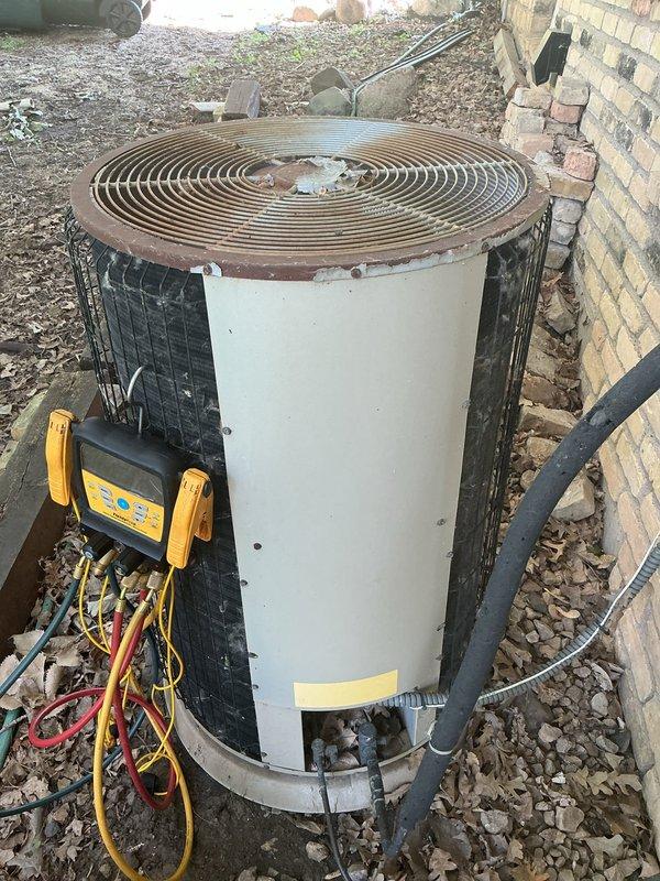 Responded to no cooling call on 31+ year old air conditioning unit experiencing short cycling. Upon arrival, diagnosed failed capacitor and replaced component. Performed comprehensive system testing which revealed failing compressor with abnormally high pressures indicating refrigerant restriction. Unit operates on obsolete R22 refrigerant. Due to compressor failure being the root cause of capacitor damage and advanced age of equipment, advised customer this repair is temporary with no guarantee of longevity. Scheduled estimate appointment for complete system replacement, with repair costs to be credited toward new equipment installation.