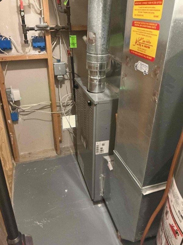 Responded to service call for consultation on adding condensate mitigation to furnace flue and eliminating a basement bathroom return vent. Upon inspection, determined that the existing unit is an 80% efficiency furnace with metal exhaust piping that reaches temperatures exceeding 400°F during operation, making installation of any moisture mitigation equipment unfeasible due to heat-related material failure concerns. Verified that a properly installed chimney cap is present on the roof, providing adequate protection against moisture intrusion and pest entry into the flue system. Conducted thorough inspection of furnace and flue assembly with no evidence of external moisture infiltration found. Examined the basement bathroom vent in question and confirmed it is not connected to the HVAC ductwork system; rather, it functions as a passive bypass opening to the mechanical room and poses no operational concerns. Advised customer that elimination of the bypass opening would require basic fra