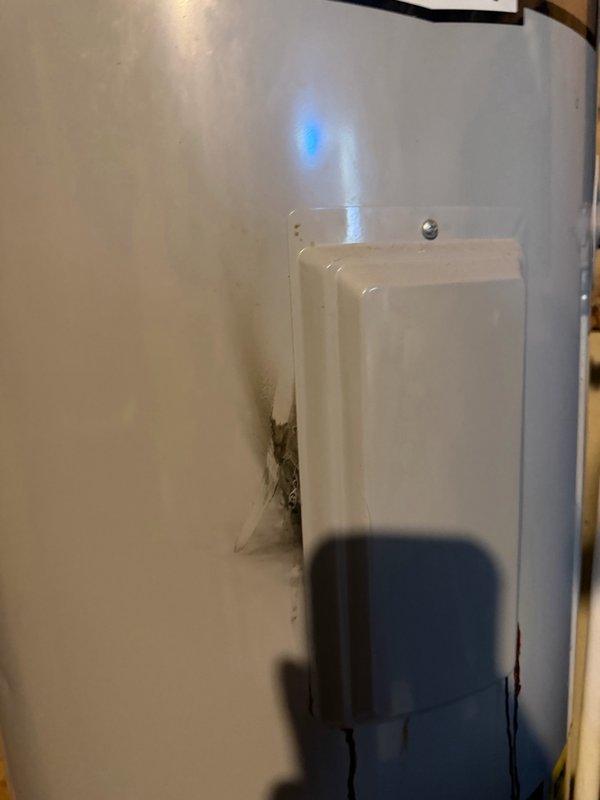 Responded to service call for leaking water heater with no hot water. Upon inspection, found AO Smith water heater originally installed in 2021 experiencing active leak from element port area with visible water pooling at base and significant rust staining on lower tank section. Confirmed unit is still under manufacturer warranty valid through 2027. Documented blowout condition at element port with photographs showing corrosion damage and water accumulation. Determined warranty replacement is required due to tank failure. Unable to complete replacement on initial visit as parts supplier was closed for weekend. Scheduled return appointment to install warranty replacement water heater once new unit is obtained from supplier.